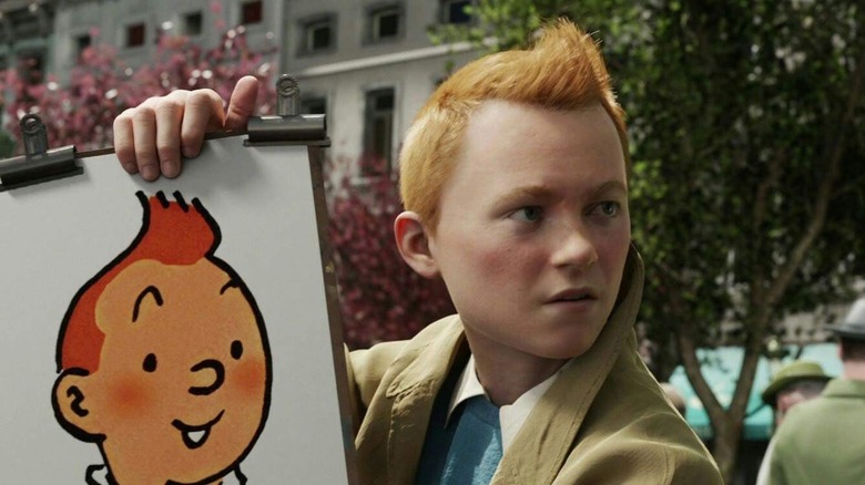 Tintin holding caricature of himself