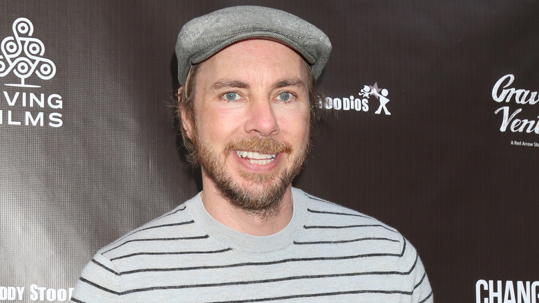 Dax Shepard smiles on the red carpet