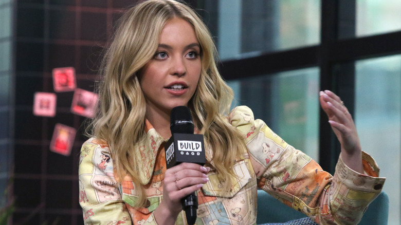 Sydney Sweeney talking with microphone