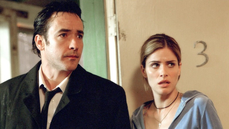 John Cusack and Amanda Peet in "Identity"