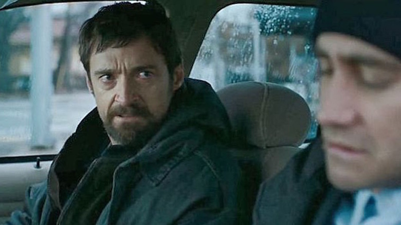 Hugh Jackman looks at Jake Gyllenhaal