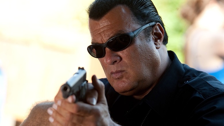 Seagal points a gun