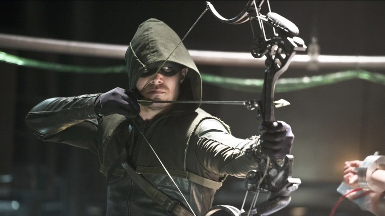 Arrow prepares to shoot his bow