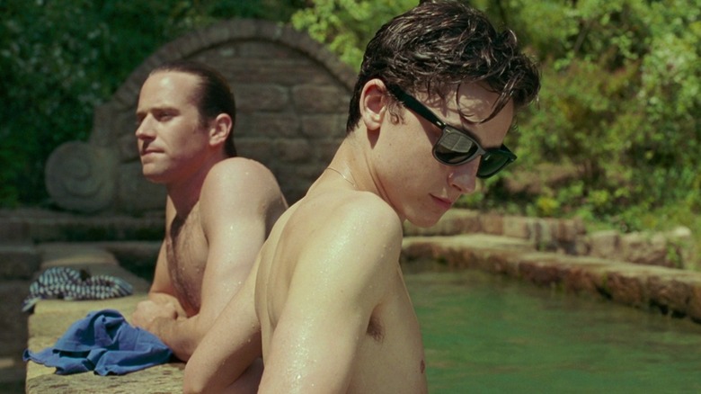 Armie Hammer and Timothée Chalamet standing in pool