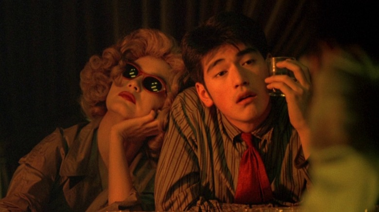 Brigitte Lin leaning on Takeshi Kaneshiro in bar