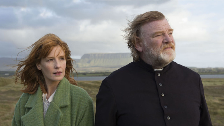 Kelly Reilly and Brendan Gleeson look into distance