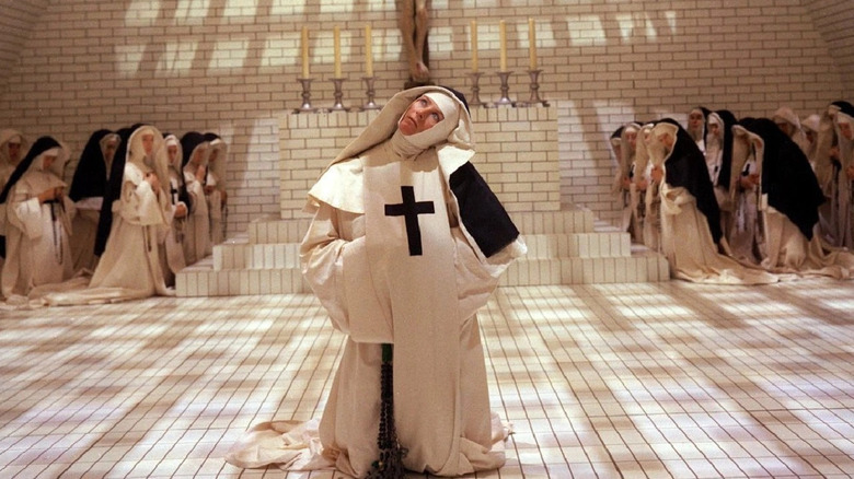 Vanessa Redgrave prays with young nuns 