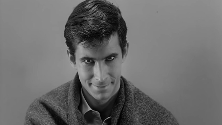 Anthony Perkins smirking