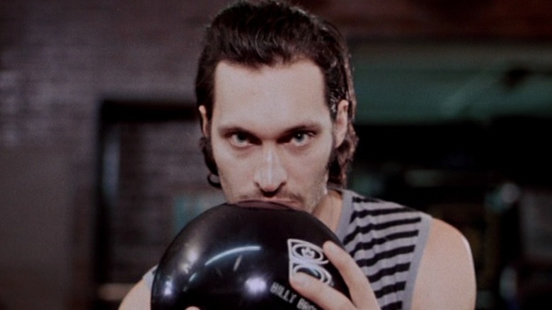 Billy holds up bowling ball