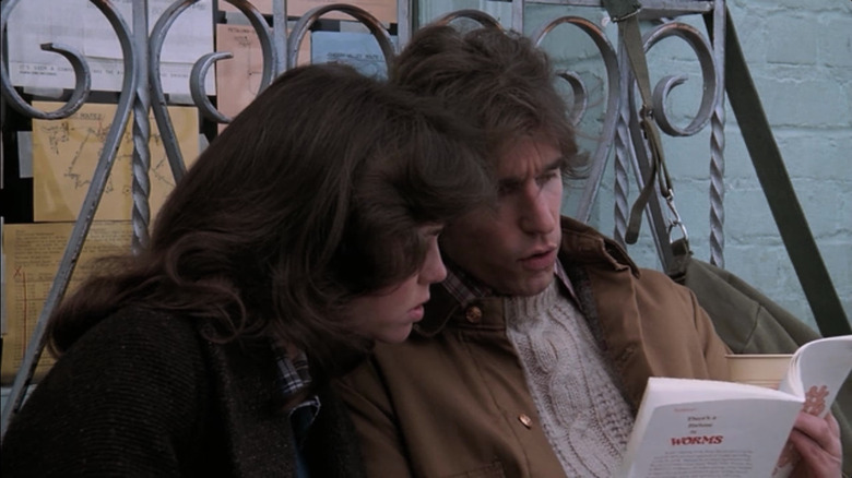 Carol and Jack sit on a bench and read a book