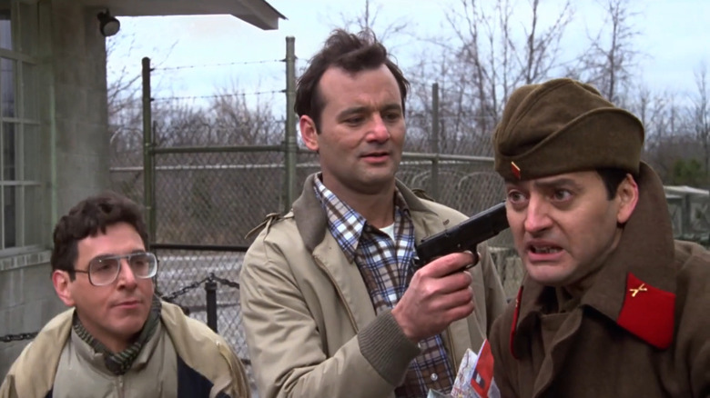 Bill Murray holds a gun to a soviet officer