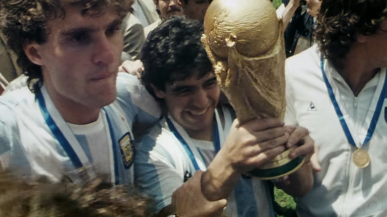 Maradona holding trophy