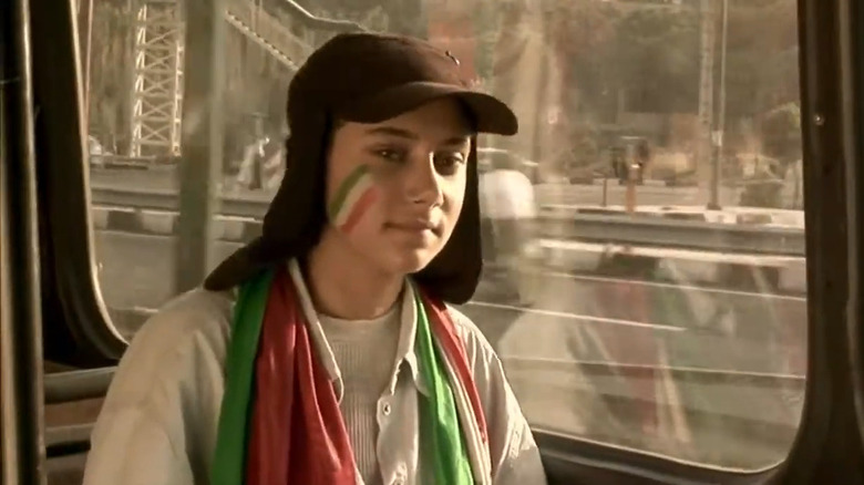 Girl in facepaint on bus 