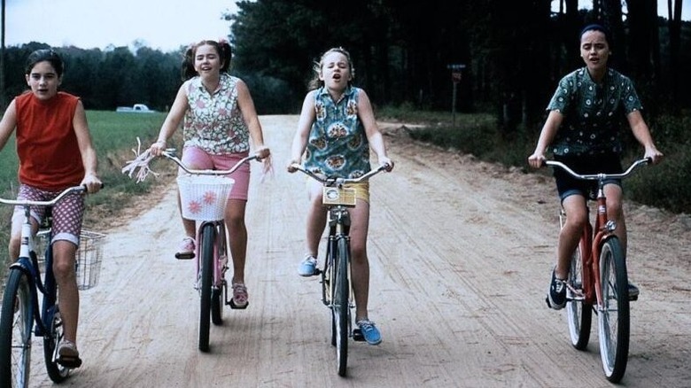 The girls ride bikes