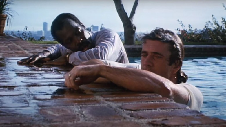 Riggs and Murtaugh getting out of water