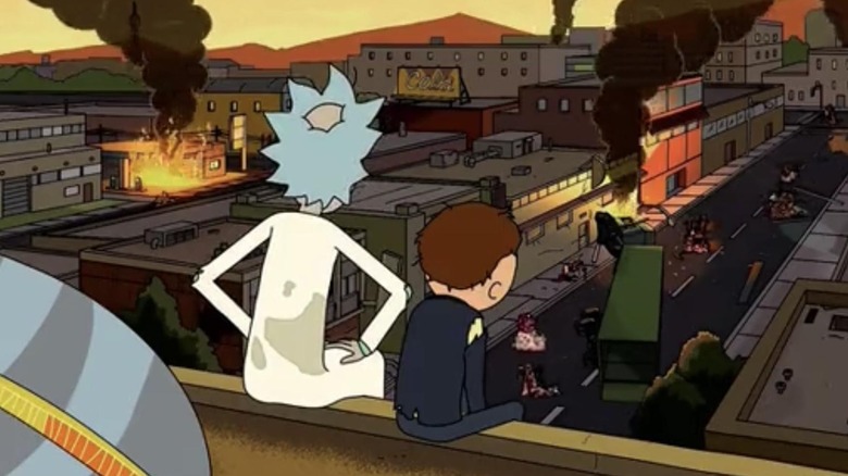 Rick and Morty surveying the damage they caused from atop a roof in "Rick Potion #9"