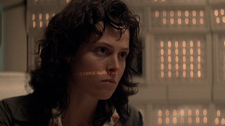 Ripley looks off to side with text on her face