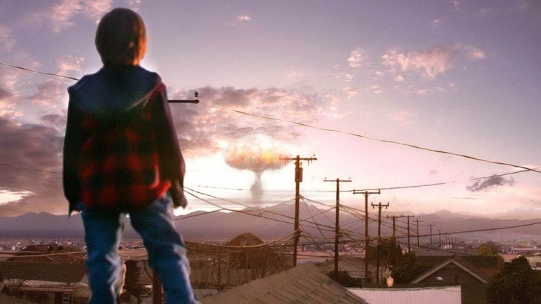 Kid standing, mushroom cloud