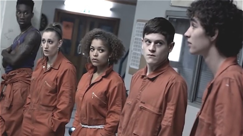 Misfits kids wearing orange jumpsuits