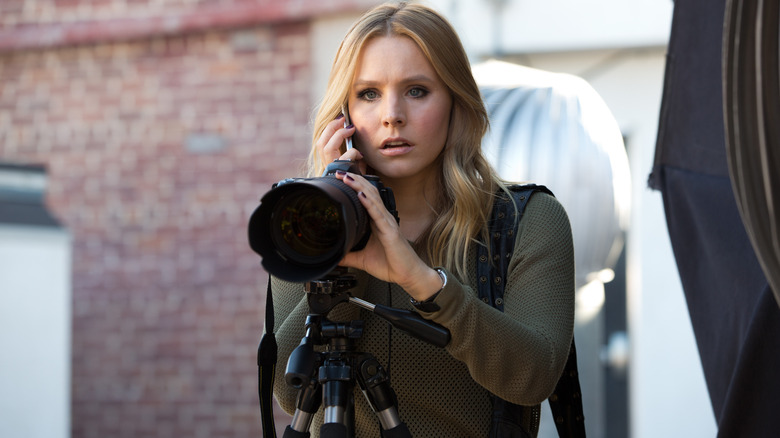 Veronica Mars holds a camera