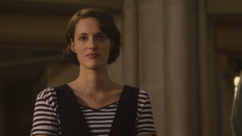 Fleabag from Fleabag standing in church