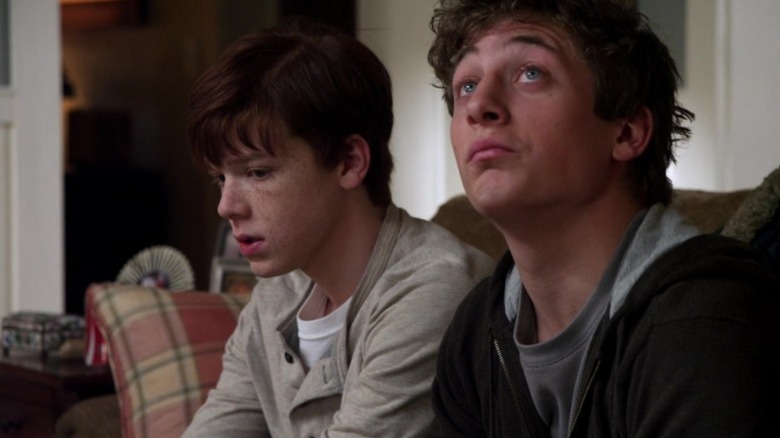 Shameless' Ian and Philip Gallagher sitting on couch