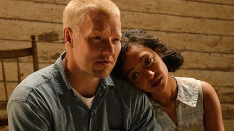 Ruth Negga leans head on Joel Edgerton's shoulder