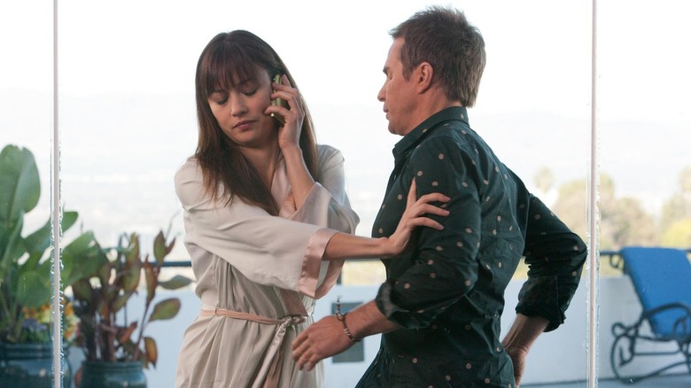 Sam Rockwell arguing with Olga Kurylenko 