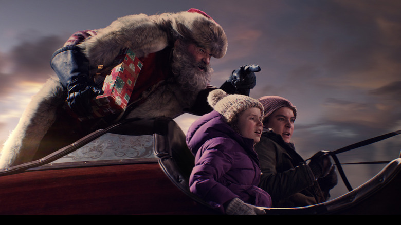 Kate, Santa and Teddy in the sleigh