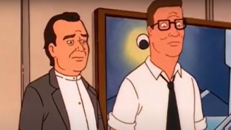 Reverend Boyce Hubert standing with Hank Hill