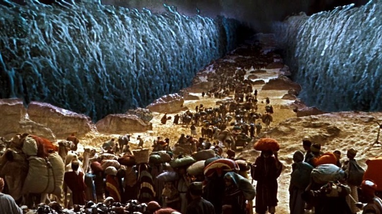 Crowds walking through parted red sea