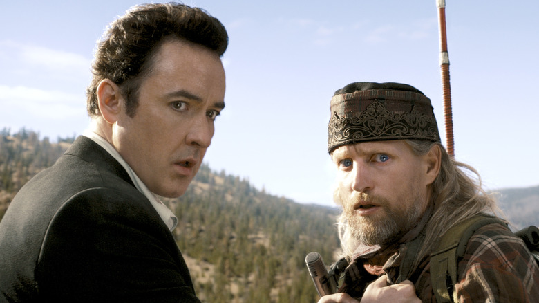 John Cusack and Woody Harrelson looking nervous 