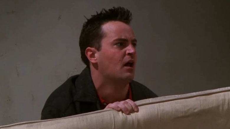 Chandler holding couch