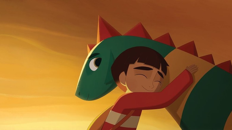 A boy hugging a dragon