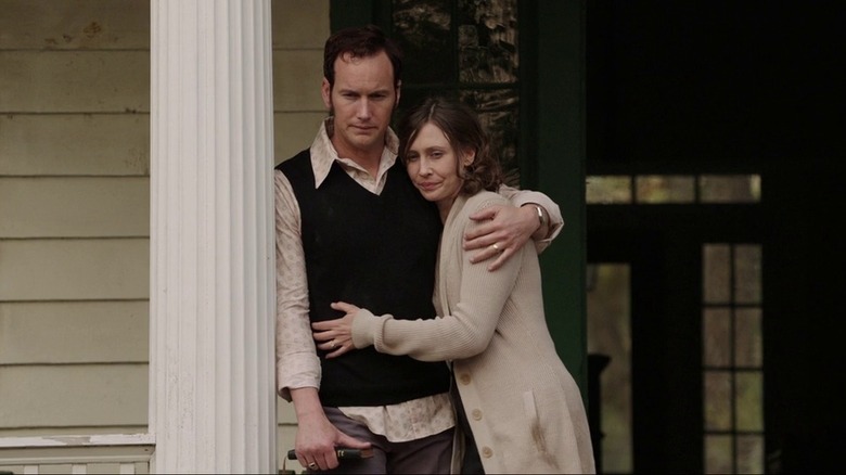 Couple outside house in The Conjuring