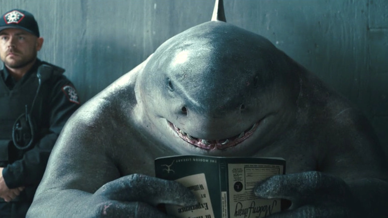 King Shark reading a book