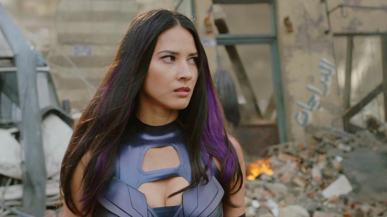 Psylocke standing amidst rubble