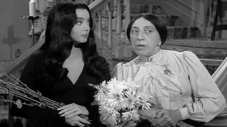 Morticia and Hester gossiping