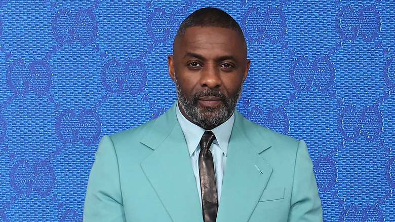 Idris Elba wearing blue suit