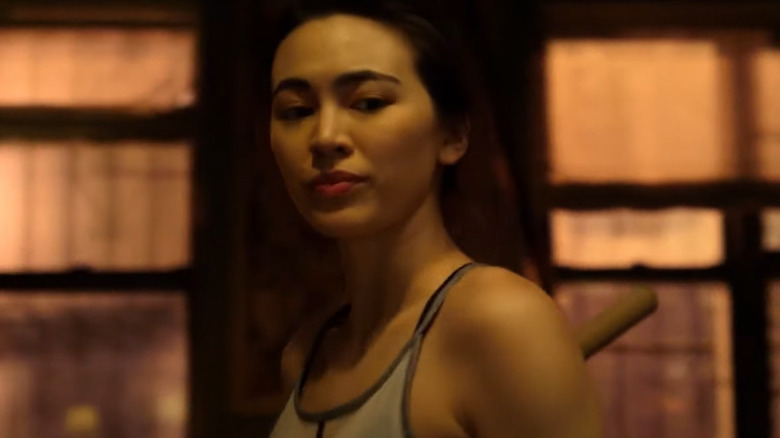 Colleen Wing smiling mysteriously