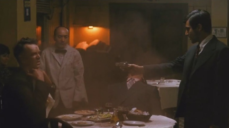 Michael pointing a gun in The Godfather