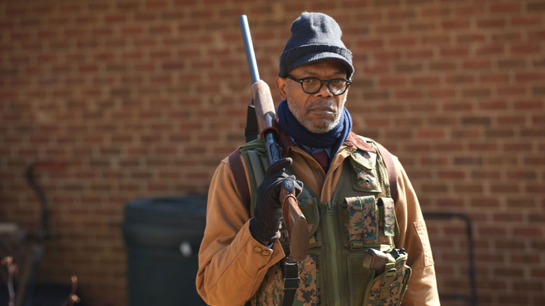 Samuel L. Jackson holding a rifle