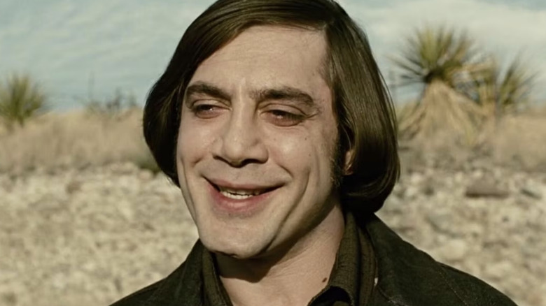 Anton Chigurh smiles in the desert in "No Country for Old Men" (2007)