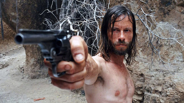 Charlie Burns brandishes a gun in "The Proposition" (2005)