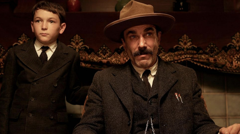 Daniel Plainview and H.W. listen intently in "There Will Be Blood" (2007)