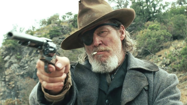 Rooster Cogburn pulls out a gun in "True Grit" (2010)