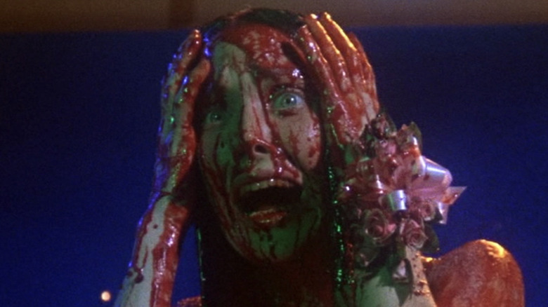 Carrie screams while covered in blood