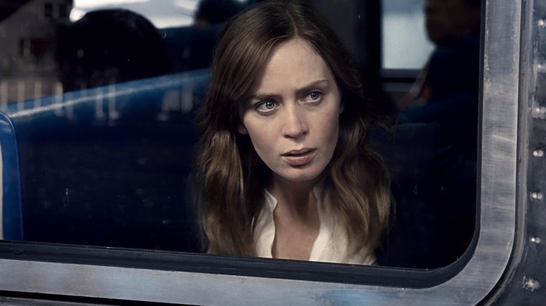 Confused Emily Blunt looks out of train window