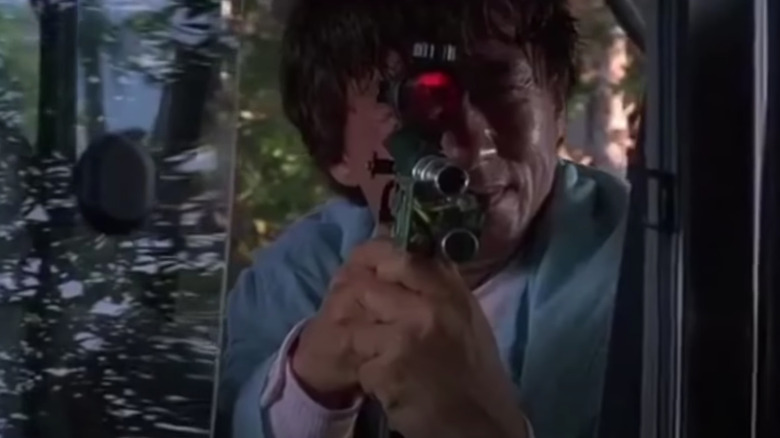 Jackie Chan aiming gun