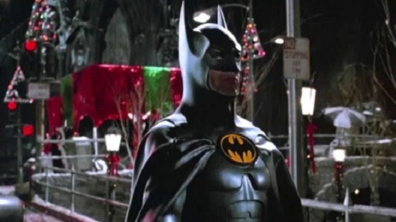 Batman in front of Christmas decor